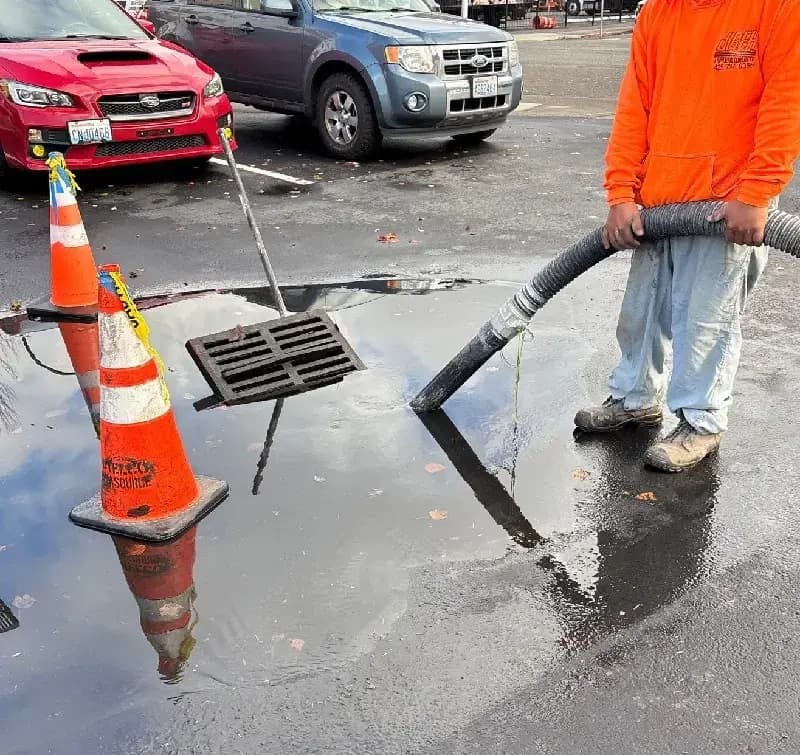 Catch basin cleaning in progress